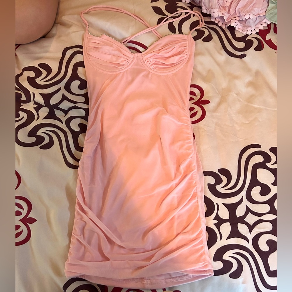 This is a mini pink party dress.